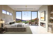 Bright main bedroom with fireplace, access to outdoor lounge area and stunning views at 4 Kaya Canyon Way # 15, Henderson, NV 89012