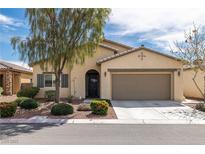 Charming single-story home featuring desert landscaping, a two-car garage and a welcoming front entrance at 4429 S Glory Vine Ln, Pahrump, NV 89061