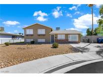 Charming two-story home featuring well-maintained landscaping and a spacious driveway at 6121 Dayton Cir, Las Vegas, NV 89107