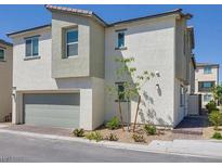 Beautiful new two-story home featuring an attached garage and well manicured landscaping in a modern community at 7017 Magenta Moon St, North Las Vegas, NV 89086