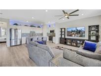 Bright, open-concept living space with modern decor and a seamless flow to the kitchen island at 1180 Solano Hills Ct, Henderson, NV 89002