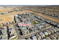 An aerial view of the community of new homes with shared pool, desert landscaping and stunning city views at 3217 Bertonico Ave, Henderson, NV 89044