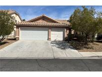 Charming single-story home with a three-car garage and well-maintained landscaping at 9436 Silvaner Ct, Las Vegas, NV 89123