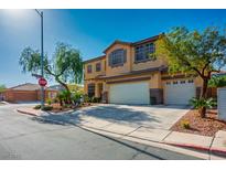 Charming two-story home featuring a spacious three car driveway, landscaping, and an inviting facade at 948 Mill Run Creek Ave, Henderson, NV 89002