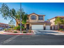 Charming two-story home with well-manicured landscaping and a three-car garage at 948 Mill Run Creek Ave, Henderson, NV 89002