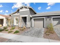 Charming single-story home with well-maintained landscaping and a two-car garage at 1174 King Lark St, Henderson, NV 89011