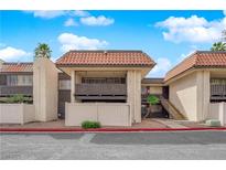 Inviting condo featuring a stucco exterior, balcony, and a red tile roof at 1440 Vegas Valley Dr # 14, Las Vegas, NV 89169