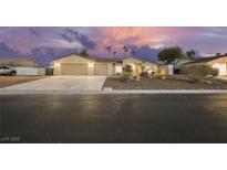 Charming single-story home with a three-car garage and desert landscaping at 4016 Tyler William Ln, Las Vegas, NV 89130