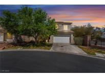 Charming two-story home with a well-manicured lawn and attached two-car garage at 5100 Amethyst Creek Ct, Las Vegas, NV 89131