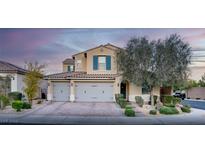 Charming two-story home featuring a three-car garage, manicured landscaping, and a welcoming entrance at 8136 Canyon Grassland St, Las Vegas, NV 89166