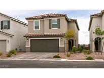 Charming two-story home featuring a tile roof, a two-car garage, and well-maintained landscaping at 9526 Granville Bridge St, Las Vegas, NV 89139