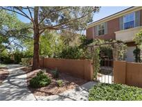 Charming two-story home with brick accent wall and landscaped front yard at 9908 Camino Loma Verde Ave, Las Vegas, NV 89117