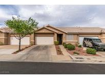Inviting single-story home with a well-maintained front yard and attached two-car garage at 199 Bailey Island Dr, Henderson, NV 89074