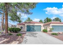 Charming single-story home featuring a well-maintained lawn and a two-car garage at 2714 Bridgepointe Dr, Las Vegas, NV 89121