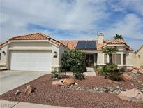 Charming single-story home with a well-manicured desert landscape and red tile roof at 2750 Sandalwood Ave, Henderson, NV 89074