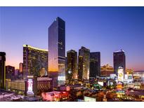 Striking skyline view of the Las Vegas strip at twilight featuring illuminated buildings and signage at 3750 Las Vegas Blvd # 3008, Las Vegas, NV 89158