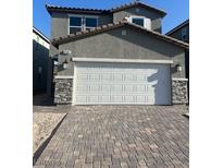 Charming two-story home with a two-car garage and beautifully paved driveway at 4145 Texas Lilac Ave, Las Vegas, NV 89139