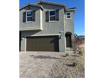 Inviting two-story home featuring a two car garage and low maintenance front yard at 4153 Texas Lilac Ave, Las Vegas, NV 89139
