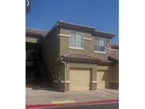 Charming condo with a one-car garage and steps leading to upper units at 6868 Sky Pointe Dr # 1034, Las Vegas, NV 89131