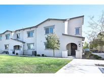 Charming two-story townhouse featuring a well-manicured lawn and inviting entrance at 788 Grand Country Ave, North Las Vegas, NV 89086
