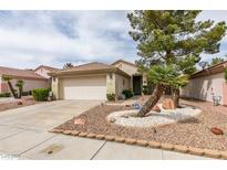 Charming single-story home featuring a well-manicured front yard with mature trees and low-maintenance landscaping at 2136 Eagle Sticks Dr. Dr, Henderson, NV 89012