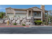 Charming two-story home with a rock-faced retaining wall and a two-car garage at 217 Big Horn Dr # 3, Boulder City, NV 89005