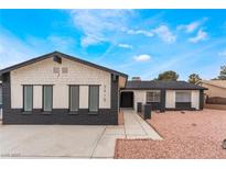 Charming single-story home featuring a unique exterior, well-manicured yard, and inviting entrance at 3915 Delling Ct, Las Vegas, NV 89104