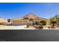 Charming single-story home featuring a three-car garage and beautifully landscaped front yard with desert plants at 6617 Golden Bit Ave, Las Vegas, NV 89131