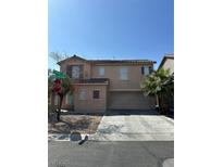 Charming two-story home featuring a neutral color palette, spacious driveway, and mature landscaping at 8089 Windmill Villa St, Las Vegas, NV 89139
