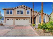 Charming two-story home featuring a three car garage, tile roof, and manicured landscaping in a sunny location at 950 Eagle Mountain Dr, Las Vegas, NV 89123
