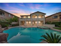 Stunning backyard pool and spa, complete with a waterfall and beautiful landscaping at 12283 Lost Treasure Ave, Las Vegas, NV 89138