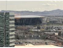 A view of the Allegiant Stadium and surrounding cityscape, with mountains in the background at 2600 W Harmon Ave # 25019, Las Vegas, NV 89158