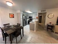 Charming eat-in kitchen with stainless steel appliances and granite countertops at 3066 Tarpon Dr # 204, Las Vegas, NV 89120