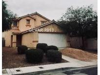 Charming two-story house with a two car garage and low maintenance landscaping at 4732 Lone Grove Dr, Las Vegas, NV 89139