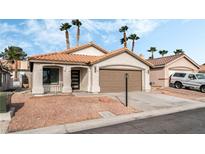 Charming single-story home with a low-pitched tile roof and desert landscaping at 5537 Sentinel Bridge St, Las Vegas, NV 89130