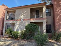Charming condo with desert landscaping, private balconies, and a welcoming facade at 5576 W Rochelle Ave # 38B, Las Vegas, NV 89103