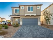 Charming two-story home features a two-car garage and well-maintained landscaping at 9871 Magnus Ct, Las Vegas, NV 89178