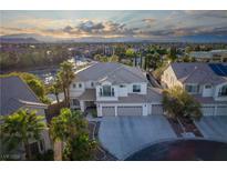 Stunning two-story home featuring a three-car garage, balcony, and well-manicured landscaping in a desirable neighborhood at 10725 Bernini Dr, Las Vegas, NV 89141