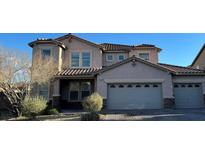 Charming two-story home featuring a three-car garage and well-maintained landscaping at 1209 Equator Ave, North Las Vegas, NV 89032