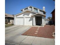 Two story home with a two car garage and neutral colored paint at 3813 Marshall Cir, Las Vegas, NV 89108