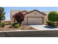 Charming single-story home with desert landscaping, a two-car garage and a well-maintained front yard at 7824 Pine Warbler Way, North Las Vegas, NV 89084