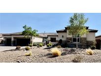Beautiful single story home with desert landscaping, and a large garage at 9511 Star Vista Ct, Las Vegas, NV 89149