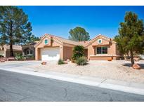 Charming single-story home featuring a two-car garage, low-maintenance landscaping, and a welcoming entrance at 9536 Ruby Hills Dr, Las Vegas, NV 89134