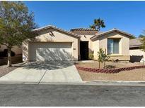 Charming single-story home boasts a well-maintained front yard and a welcoming facade at 10516 Angel Dreams Ave, Las Vegas, NV 89144