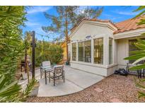 Private patio with outdoor seating, a grill, and string lights, perfect for entertaining or relaxing at 2292 Cassatt Dr, Henderson, NV 89074