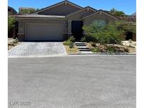 Charming single-story home with well-manicured landscaping and a two-car garage at 2771 Free Formed Ct, Las Vegas, NV 89138