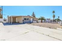 Charming single-story home featuring a spacious driveway and minimalist desert landscaping at 2990 La Canada St, Las Vegas, NV 89169