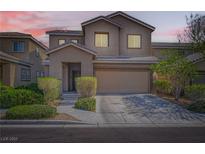 Charming two-story home featuring desert landscaping, covered entry, and attached two-car garage at 7900 Eastern Elk St, Las Vegas, NV 89149