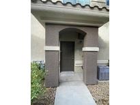 Inviting front entry featuring a covered porch with decorative pillars and a modern door at 9050 W Warm Springs Rd # 1123, Las Vegas, NV 89148