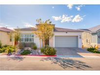 Beautiful single-story home featuring desert landscaping, a two car garage, and a modern stucco facade at 9057 N Skye Treeline St, Las Vegas, NV 89166